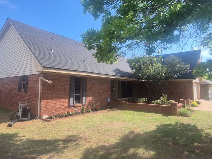New architectural shingle roof on a brick home in the Tulsa metro, completed by Black Crown Construction