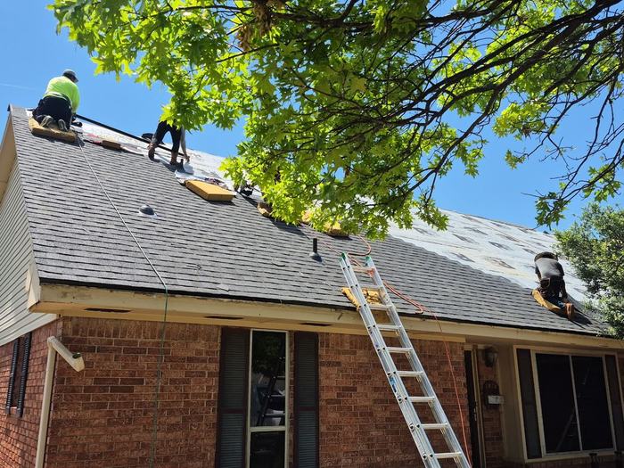 Black Crown Construction crew replacing a roof on an Oklahoma home