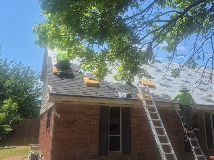 Roof tear-off and replacement in progress by Black Crown Construction in Oklahoma